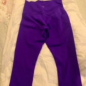 Bright purple Lululemon crops with roll-down waist